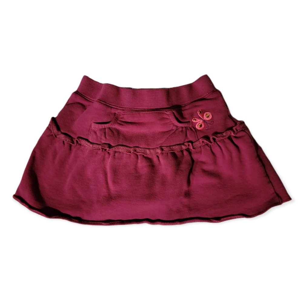 Guess Baby Plum baby skirt with bottom snaps.